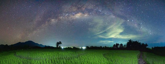 Panoramic photo of the milky way at night in the mountains of indonesia