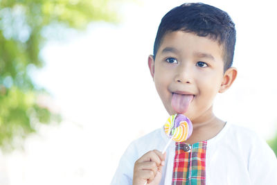 Portrait of cute boy holding ice cream