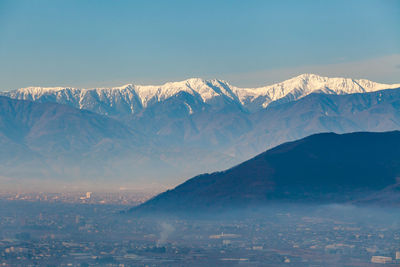 Scenic view of snowcapped mountains against sky