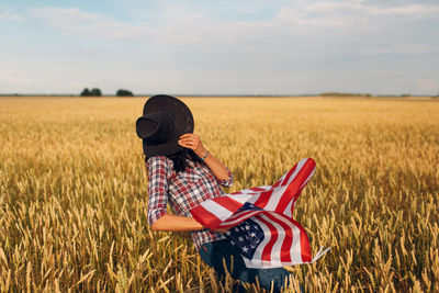 Woman standing in field