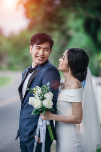 Rear view of couple standing at park