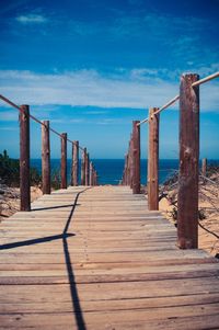 Boardwalk against blue sky