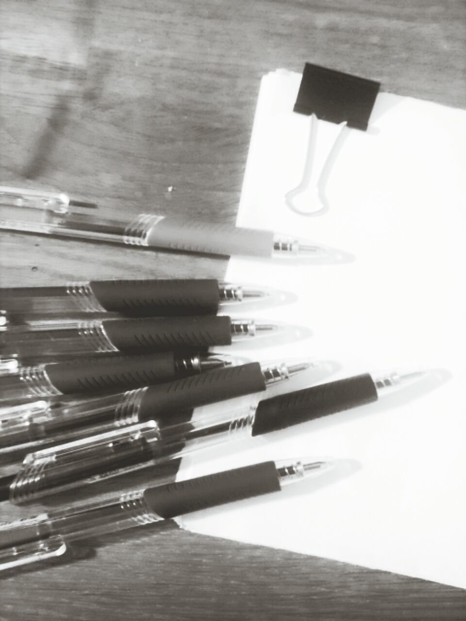 indoors, table, still life, high angle view, paper, education, book, large group of objects, arrangement, variation, in a row, close-up, wood - material, document, no people, pen, order, absence, page, desk