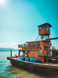 Lifeguard hut by sea against sky