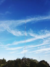 Low angle view of metallic tower against sky