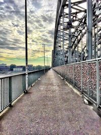 Surface level of road against cloudy sky