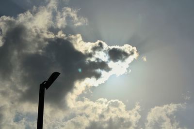 Low angle view of street light against sky on sunny day