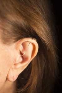 Close-up of woman wearing hearing aid