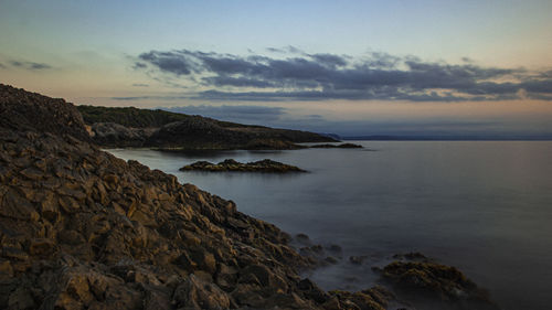 Scenic view of sea against sky during sunset