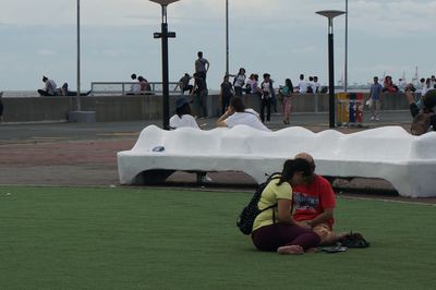 Rear view of people sitting in train