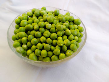 High angle view of green peas in bowl