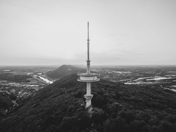 Scenic view of sea by building against sky