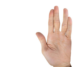 Close-up of human hand against white background