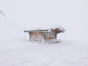 House on snow covered field