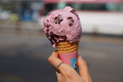 Midsection of woman holding ice cream