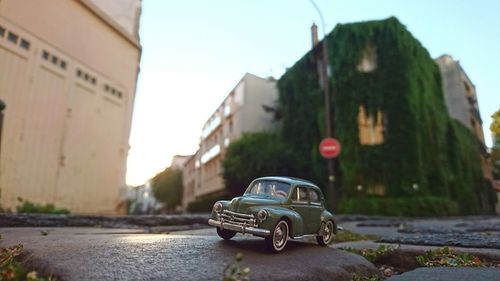 Close-up of car on road against sky