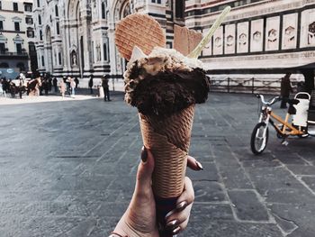  woman's hand on street in city