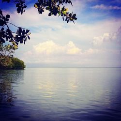 Scenic view of sea against cloudy sky