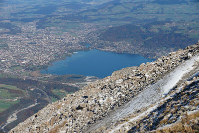 View of calm sea against mountain range