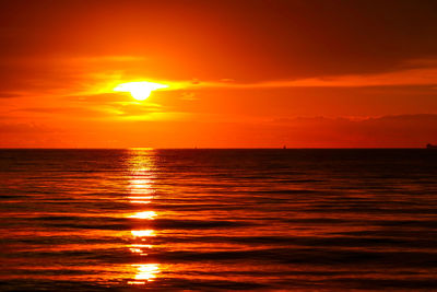 Scenic view of sea against romantic sky at sunset