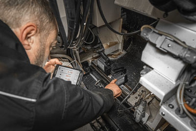 High angle view of man working at bus