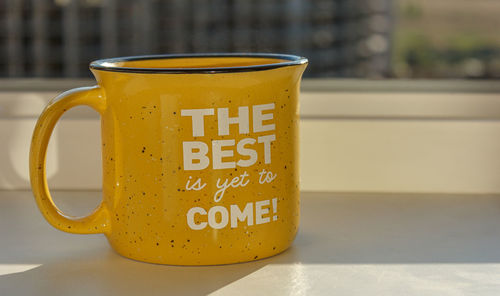 Close-up of coffee cup on table