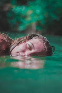 Portrait of woman swimming in pool