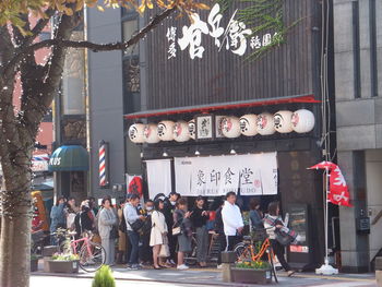 Group of people on street in city