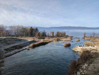 Scenic view of river against sky