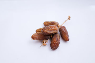 Close-up of coffee beans against white background