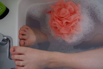 Midsection of woman in tub