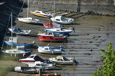 High angle view of boats moored at harbor