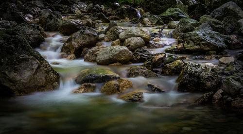 River flowing through rocks in forest