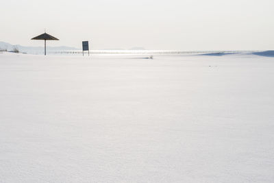 Scenic view of beach against clear sky