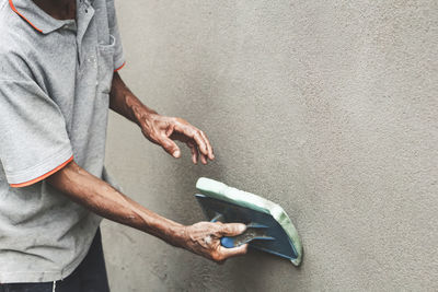 High angle view of man standing by wall