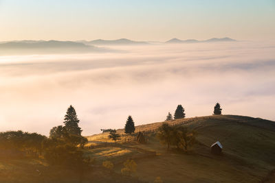 Scenic view of landscape against sky during sunset