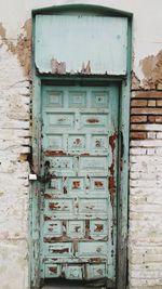 Close-up of mailbox on door