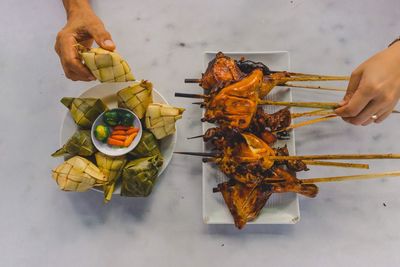 High angle view of person preparing food on table