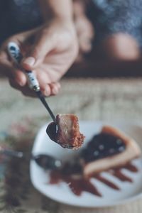 Close-up of hand holding ice cream