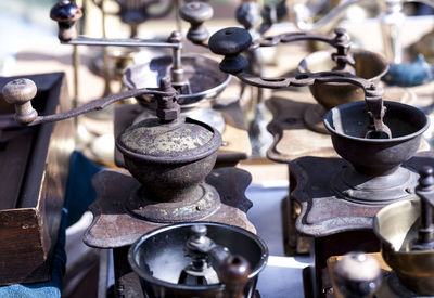 High angle view of antique coffee grinders for sale at market