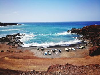 Scenic view of beach against clear sky