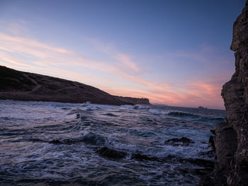 Scenic view of sea against sky during sunset