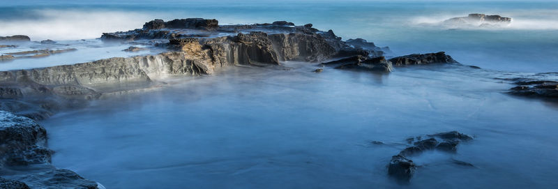 Scenic view of rock formation at beach