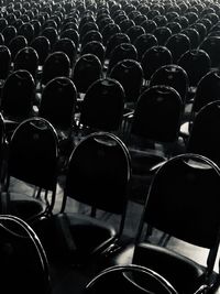 Rear view of people in empty chairs