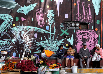 Group of people at market stall