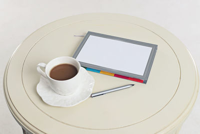 High angle view of coffee cup on table