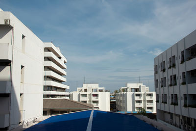 Buildings in city against sky