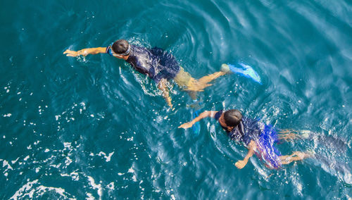 High angle view of man swimming in sea