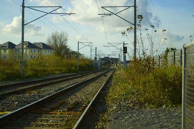 Railway tracks along countryside landscape