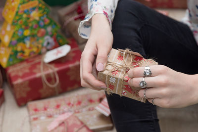 Close-up of woman holding gift boxes